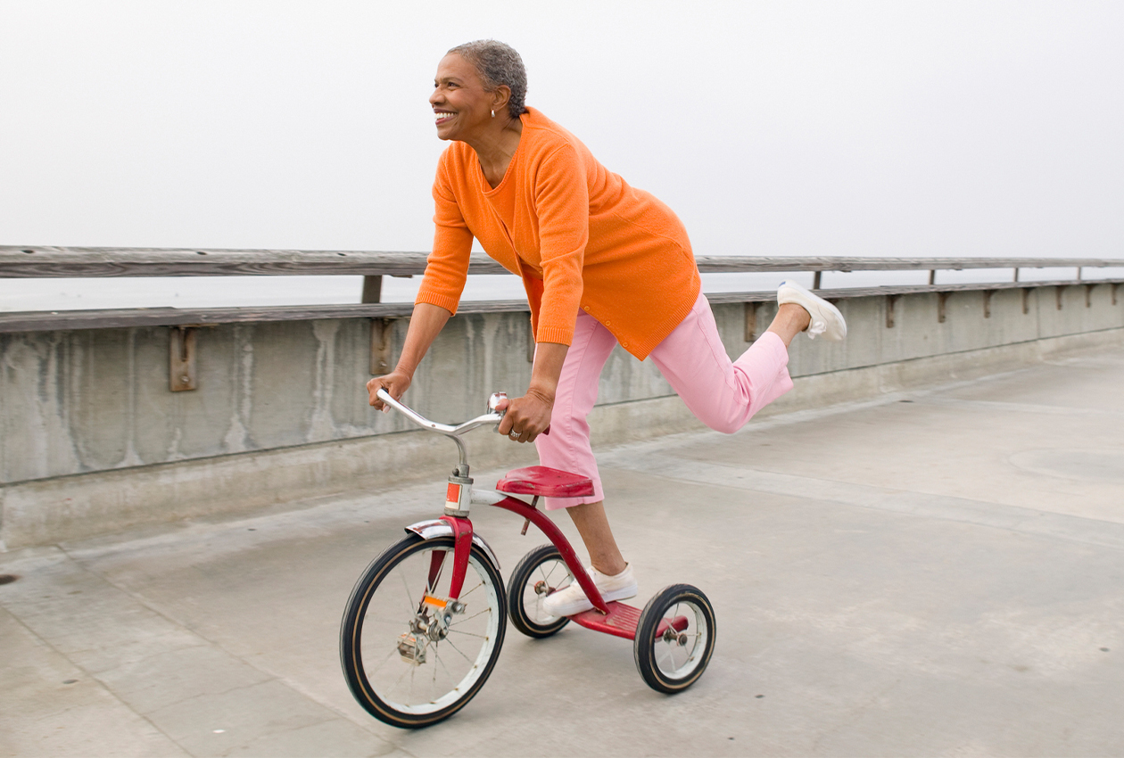 Woman riding a tricycle
